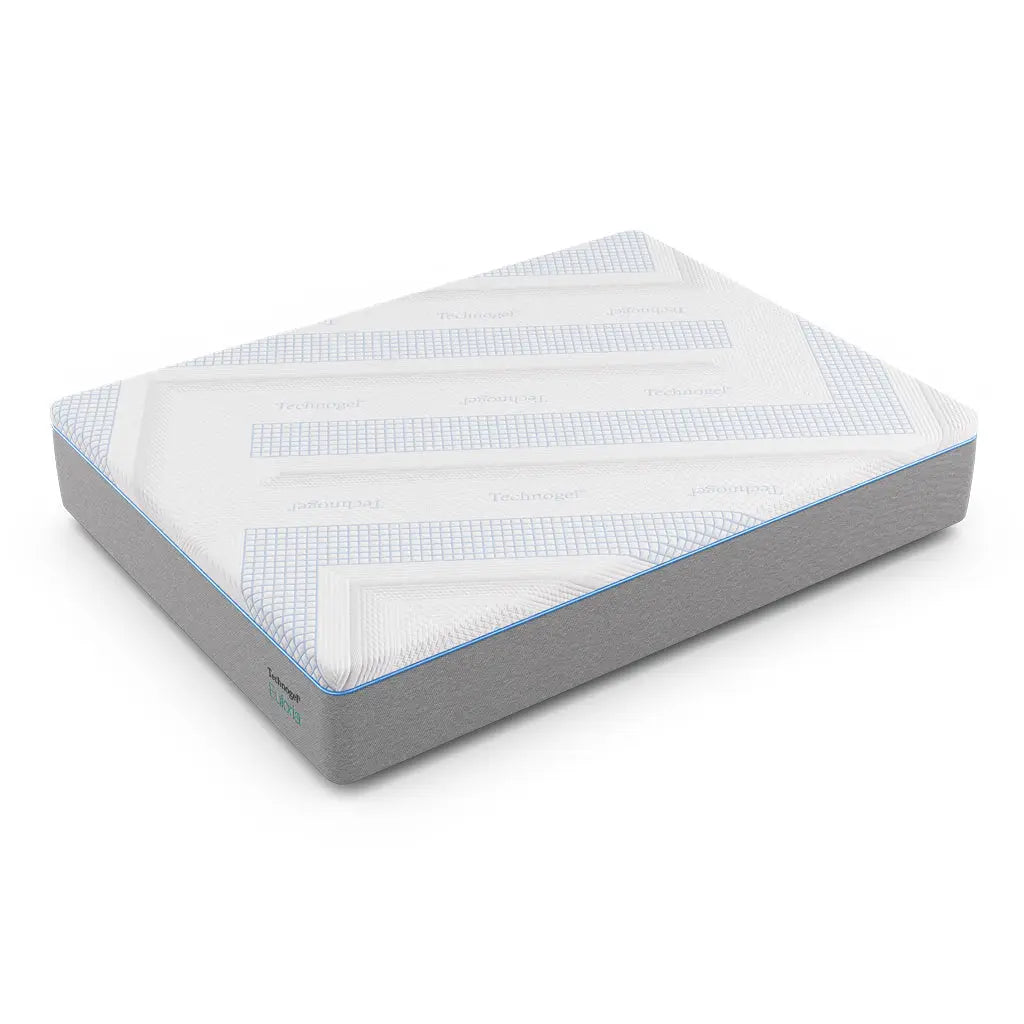 A Technogel® Euforia mattress is shown on a white background, featuring a smooth gray base and a breathable white top cover with blue geometric accents. The design highlights its clean lines and modern aesthetic.