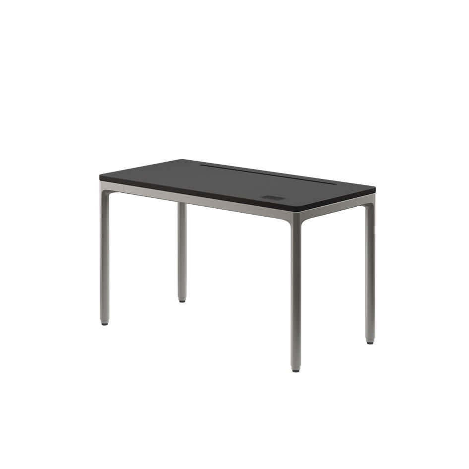 Rectangular table with black glass top and metal legs on a white background