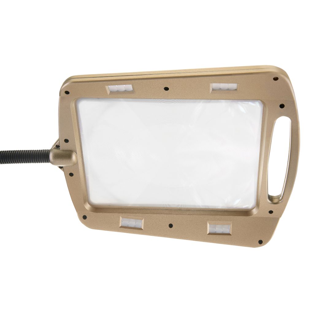 Bronze magnifying lamp against a white background