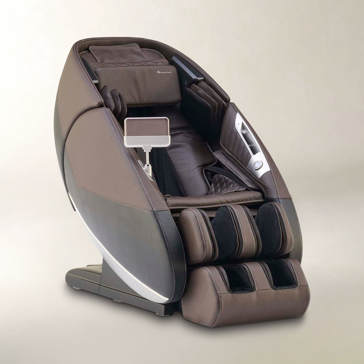 A modern electric massage chair in brown and dark gray with a small built-in tablet screen, photographed on a neutral beige background.