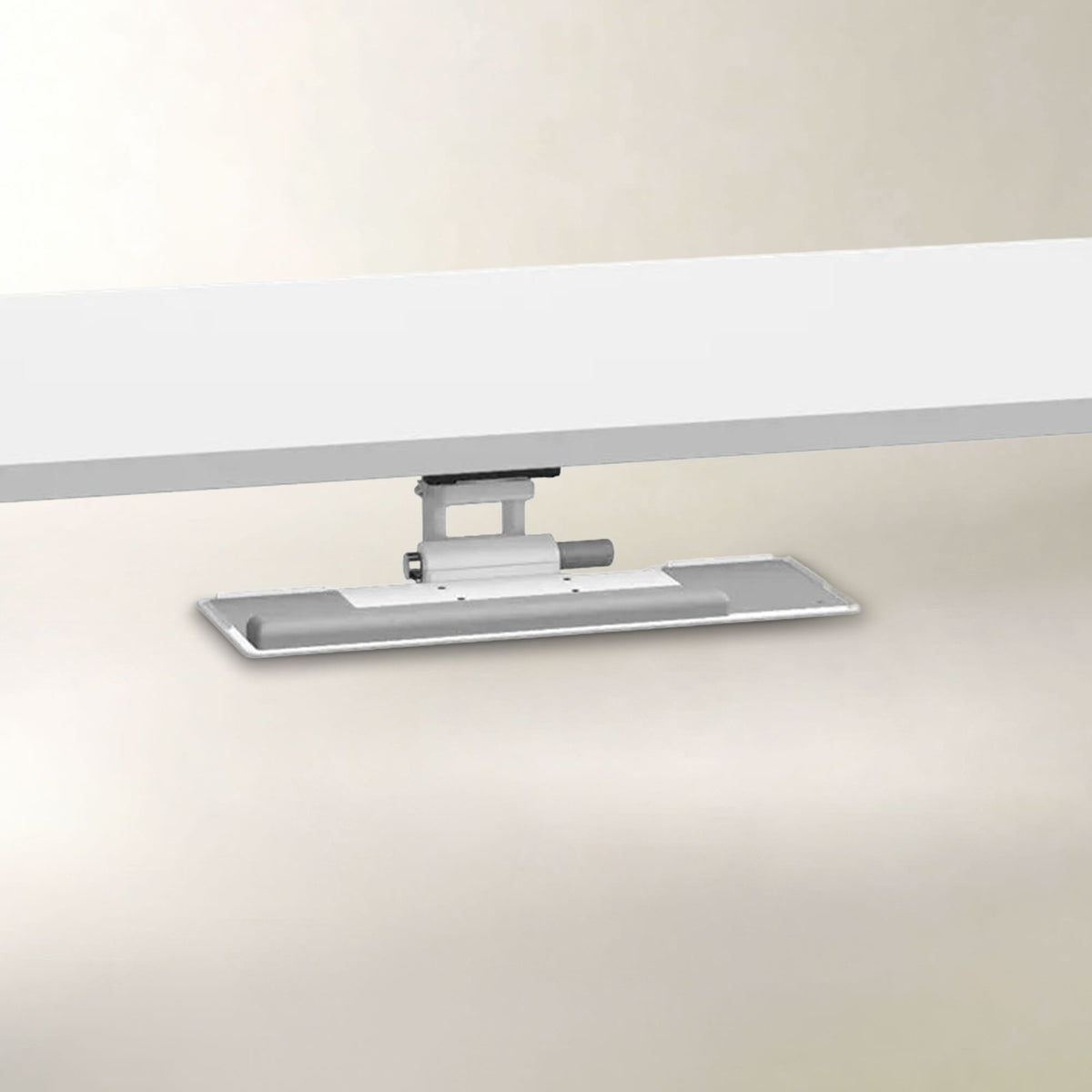 A modern silver and white under-cabinet LED light bar mounted beneath a white desk or shelf, shown against a clean beige background.