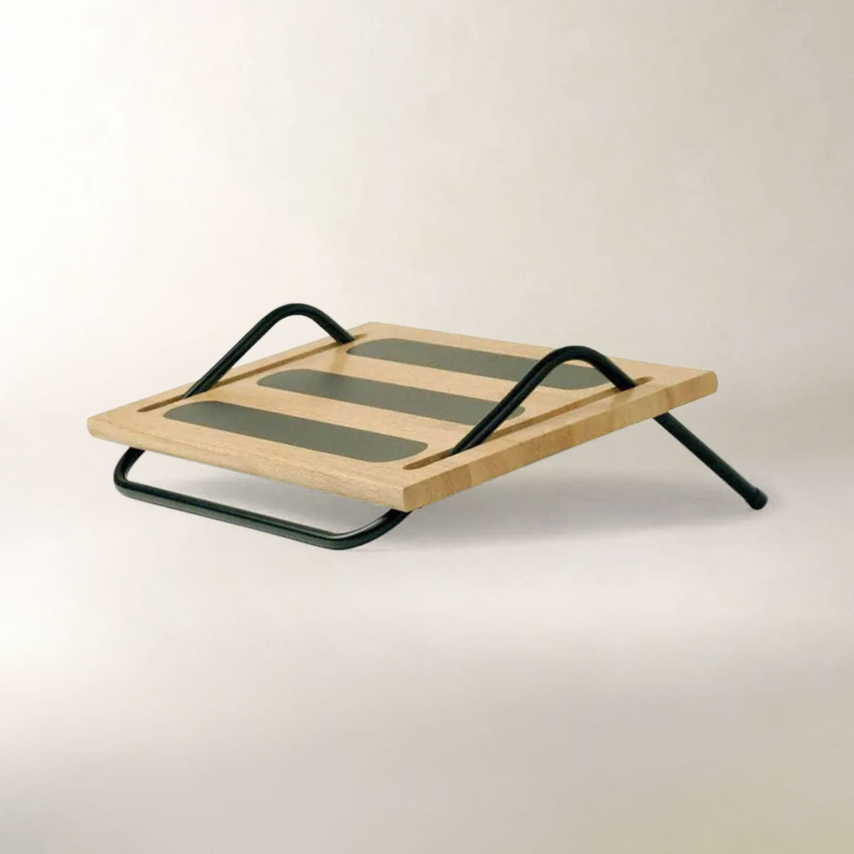 A modern wooden desk riser with a light natural wood top, three dark green rectangular slats, and a black metal frame, shown on a neutral off-white background.