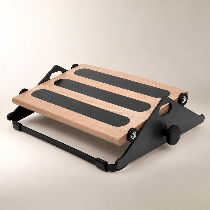 Humanscale Foot Machine ergonomic footrest with wood platform, non-slip grips, and black adjustable frame.