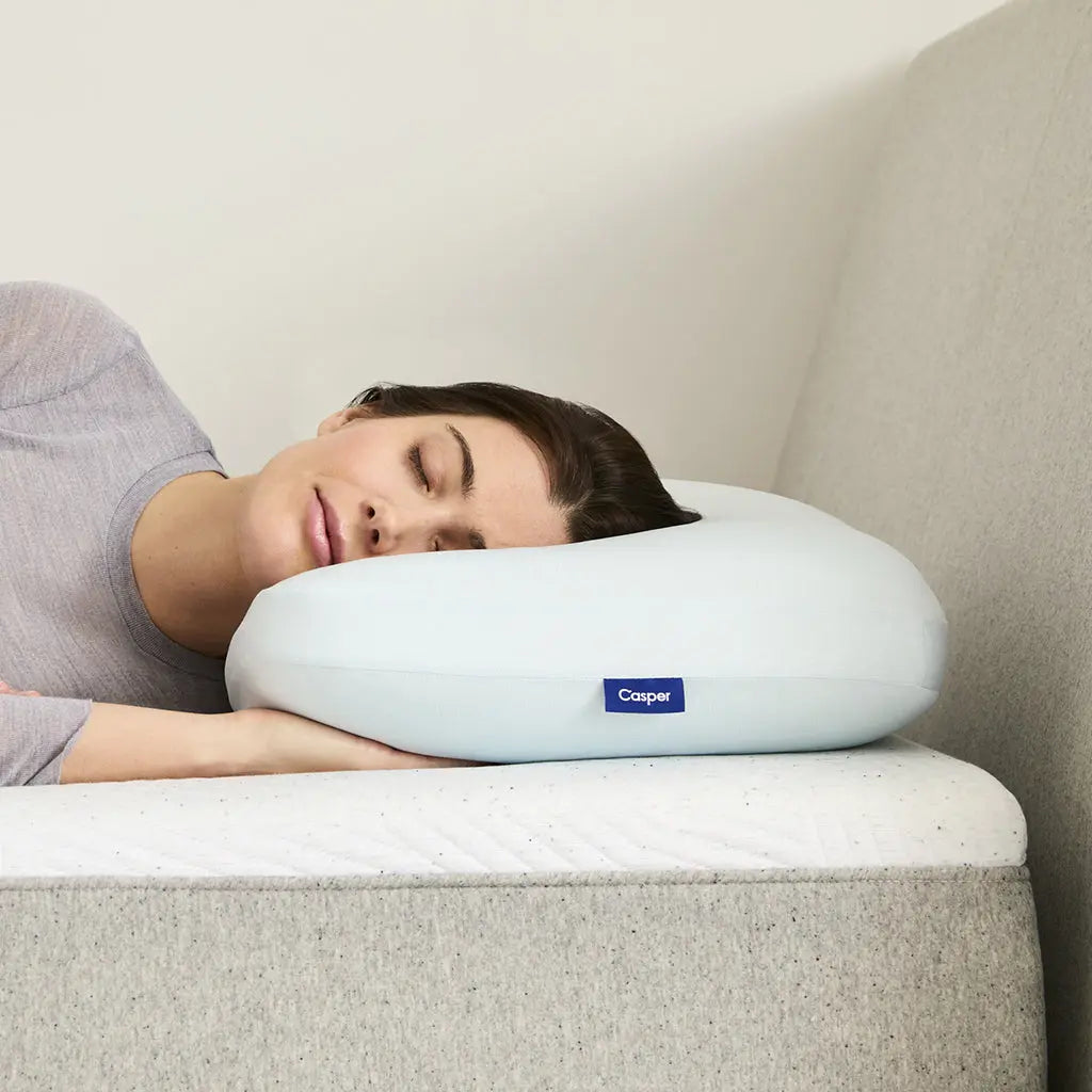 A woman using the Hybrid Snow Pillow.