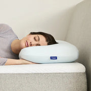A woman using the Hybrid Snow Pillow.