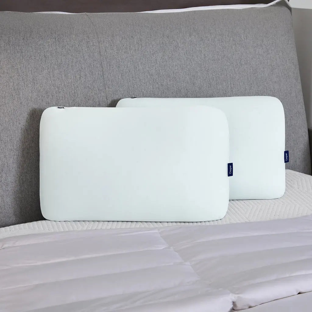 Two Hybrid Snow Pillows on a mattress.
