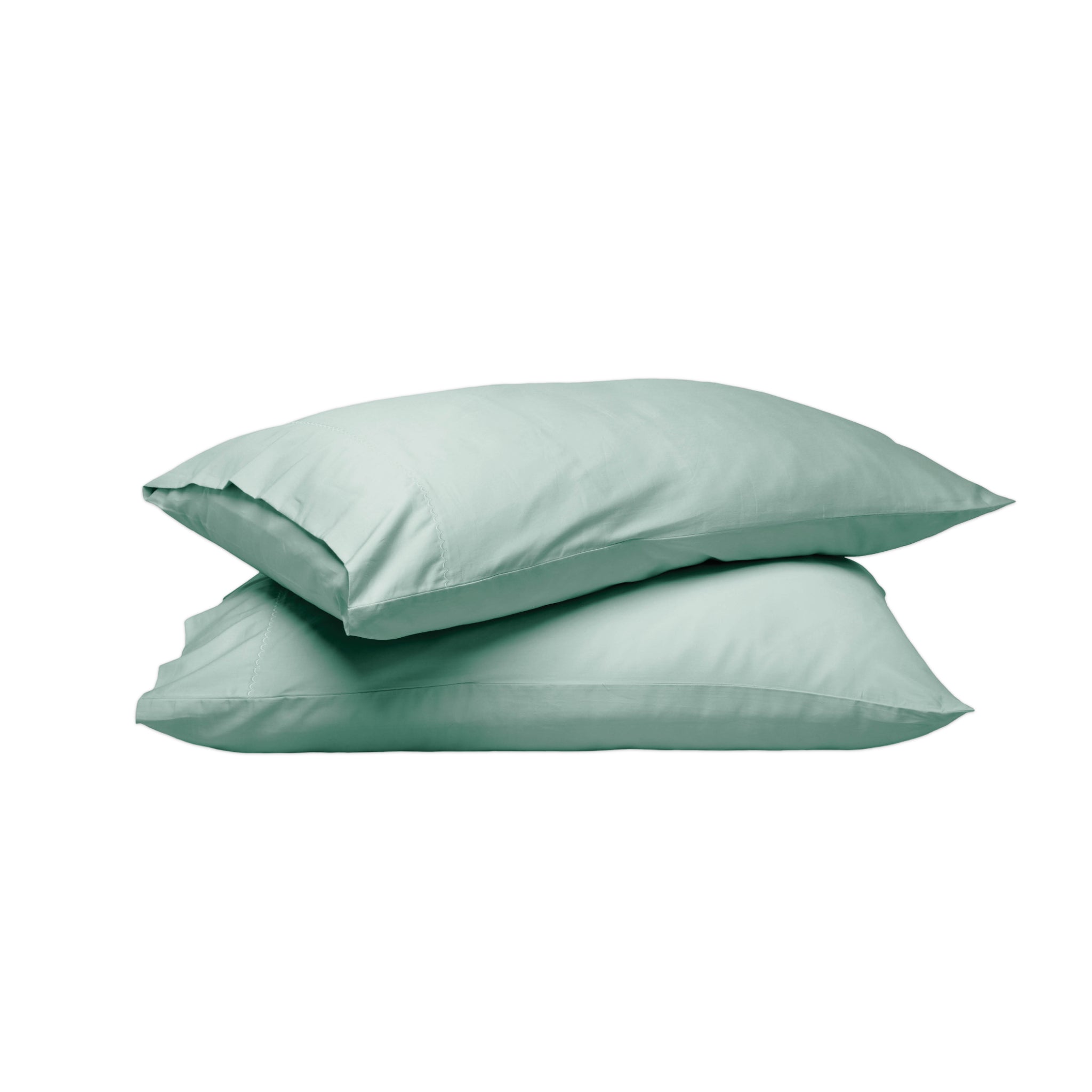 Two mint green pillowcases stacked on a solid white background.