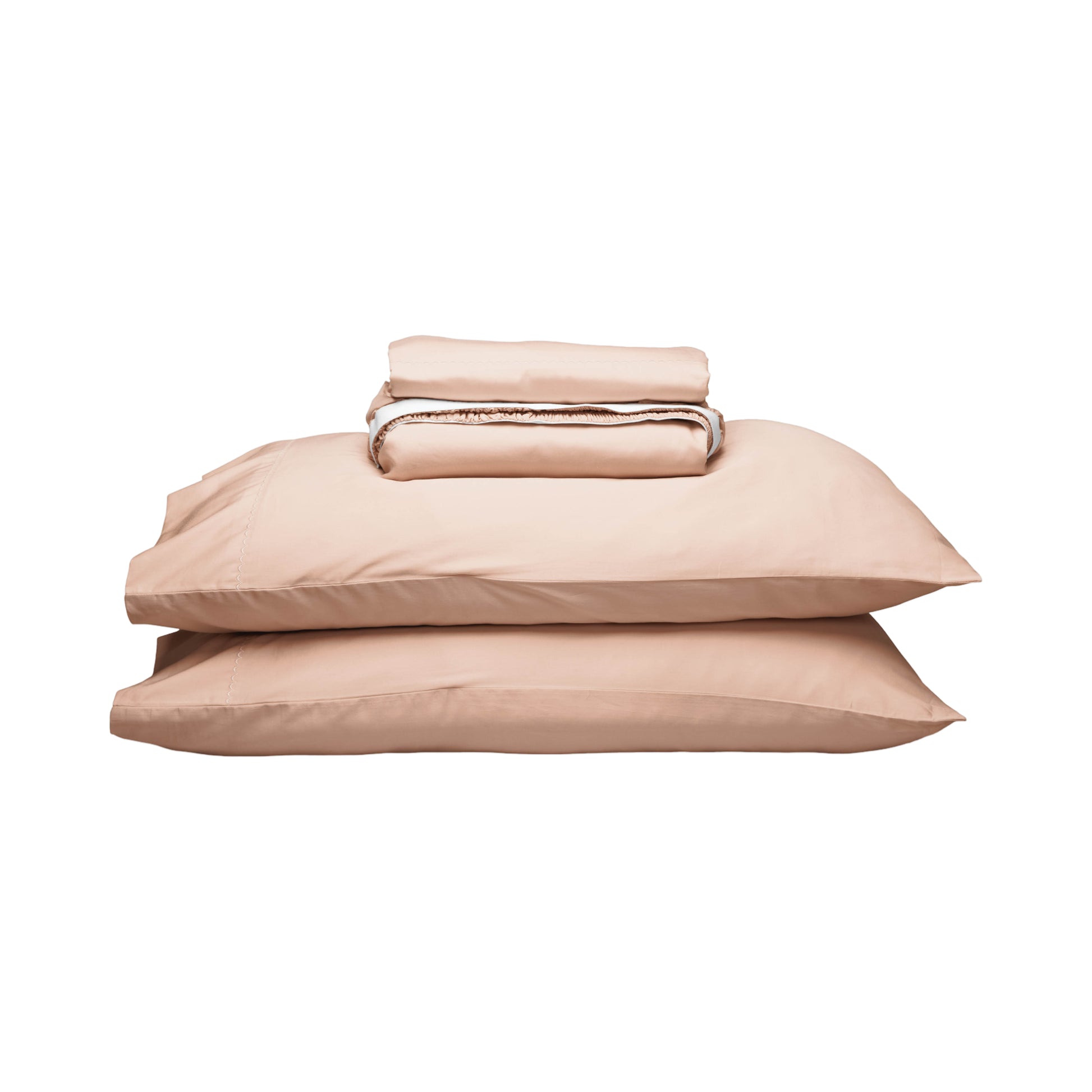 A neatly stacked bedding set in a soft blush pink color, including two pillows and a folded folded sheet, isolated on a white background.