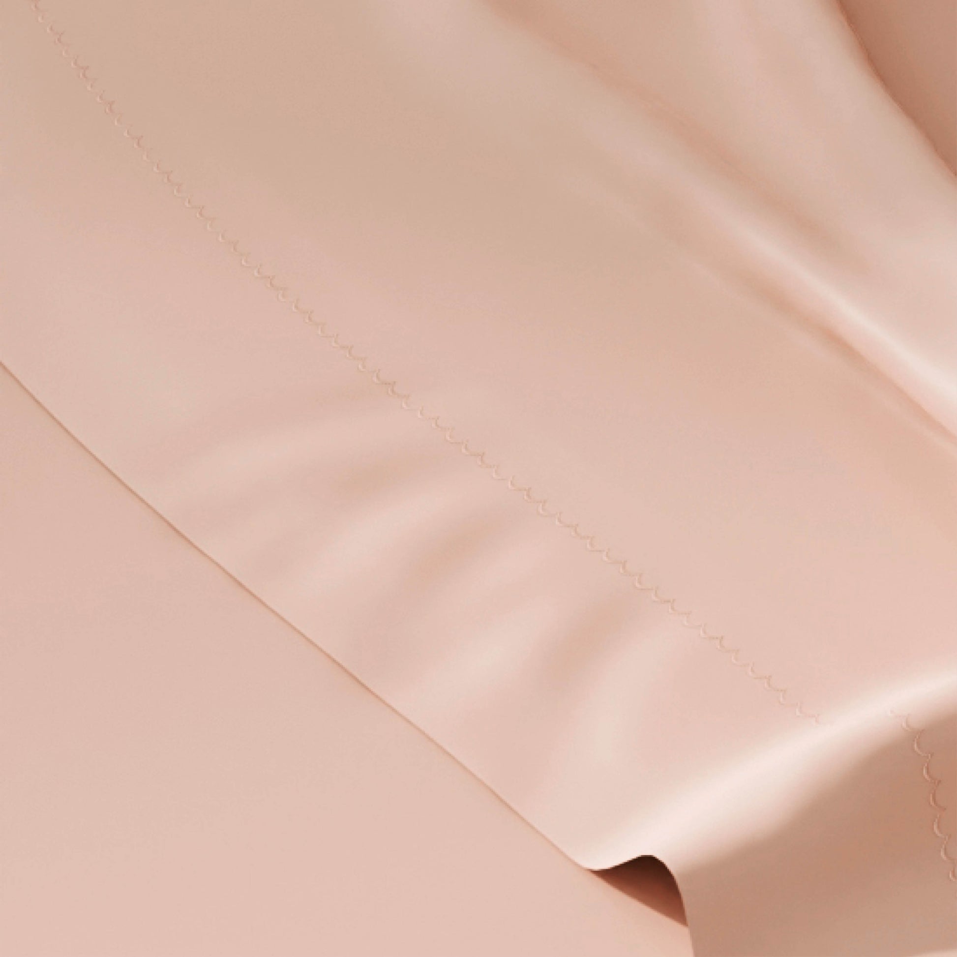 Close-up of pink fabric with a subtle texture