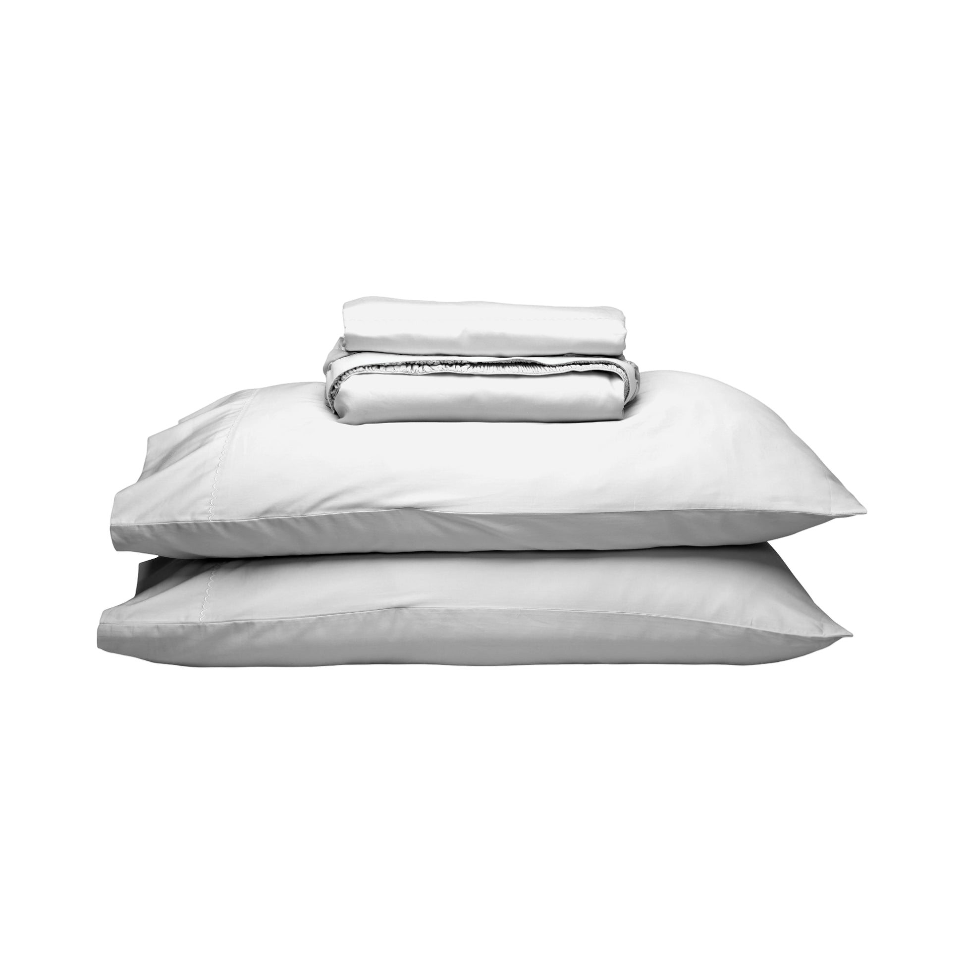 A stack of white pillows with a folded white sheet or duvet on top, photographed against a plain white background.