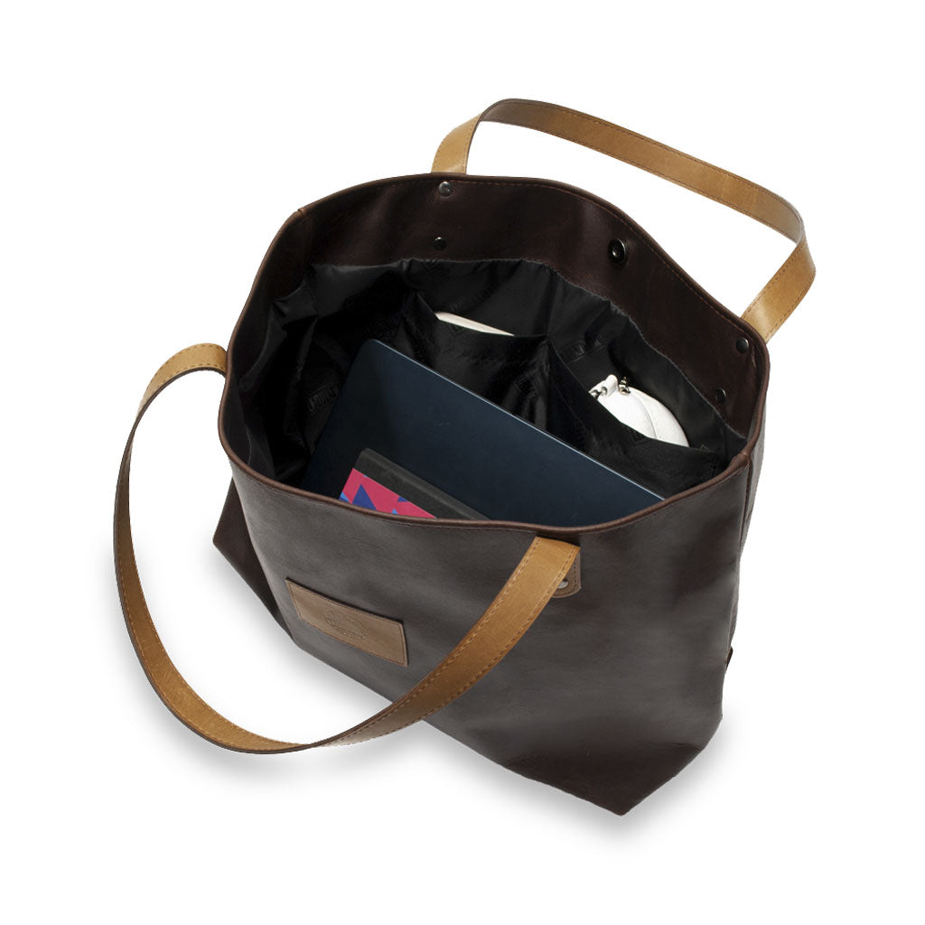 Brown leather tote bag with brown straps on a white background