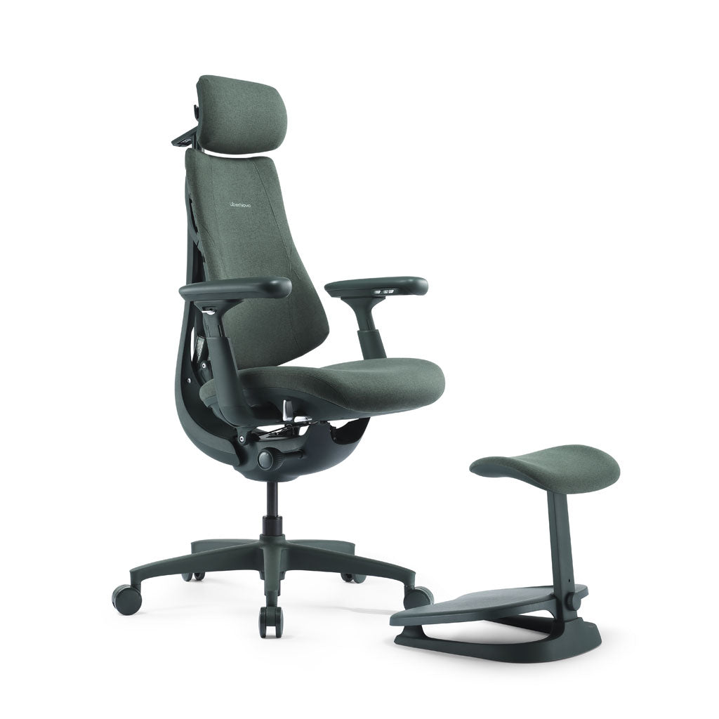 Ergonomic office chair with armrests and footrest on a white background