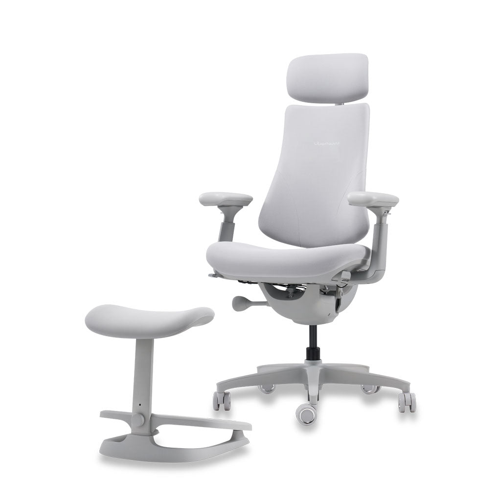 White ergonomic office chair with headrest and footrest on a white background