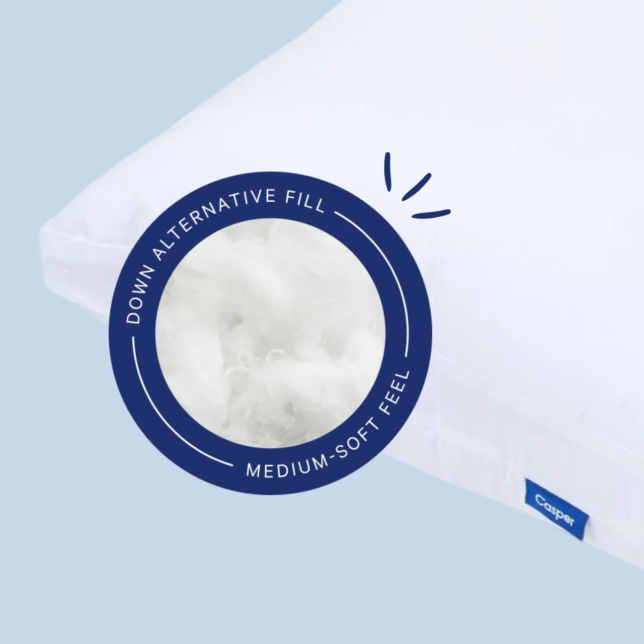 White pillow with a label on a light blue background