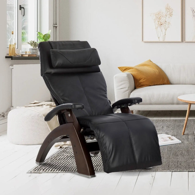 Black chair in a modern living room with a sofa and coffee table.