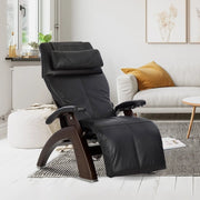 Black chair in a modern living room with a sofa and coffee table.