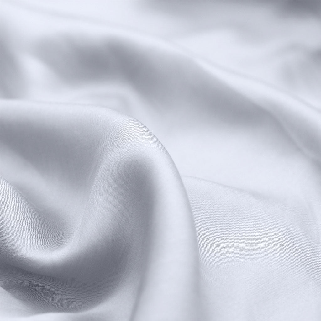 Close-up of light blue fabric with folds