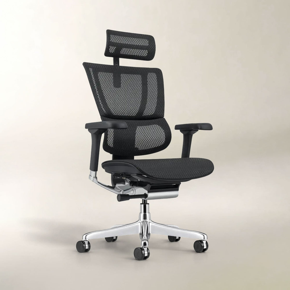 A black mesh ergonomic office chair with adjustable armrests, a headrest, and a chrome five-star base with casters, shown against a neutral beige studio background.