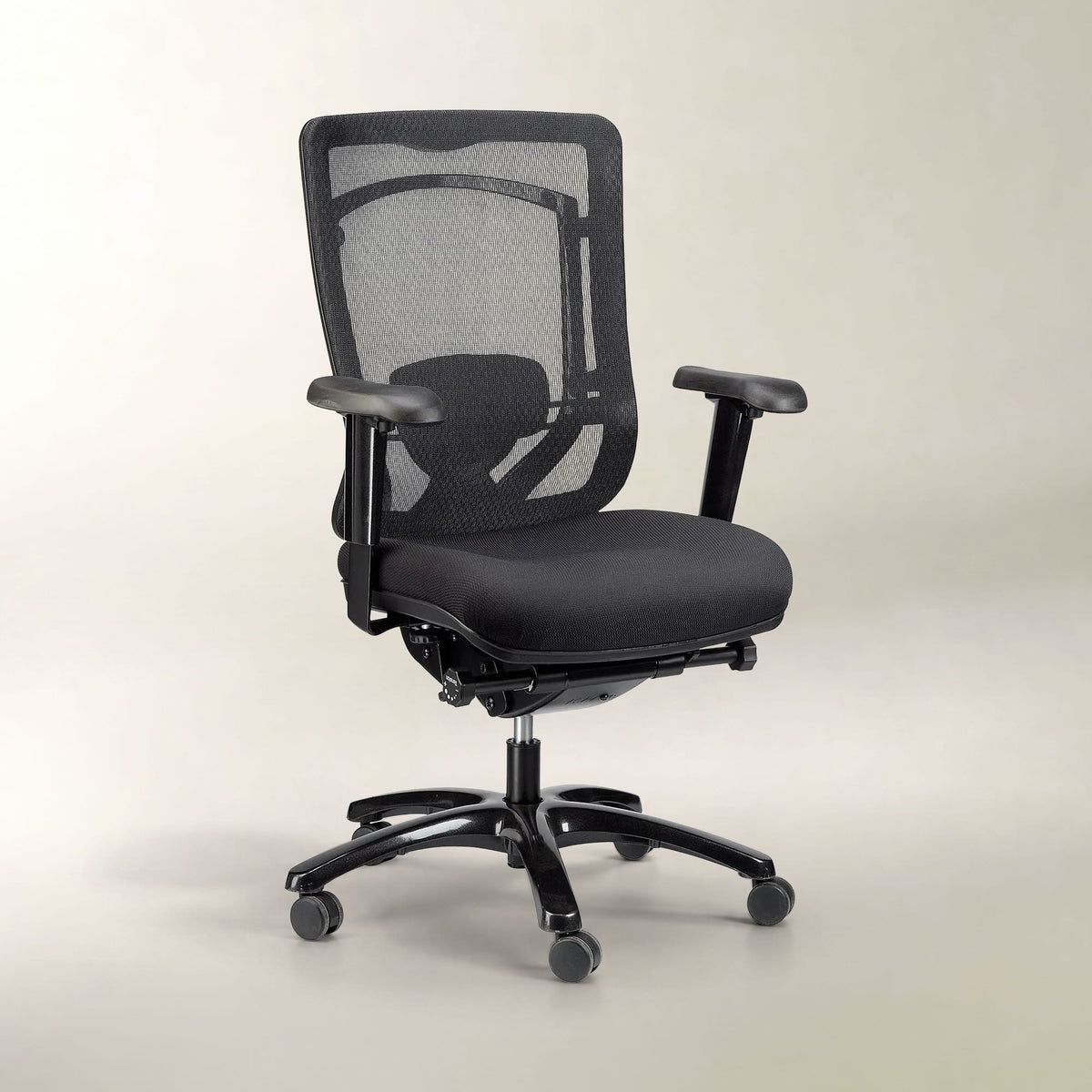 A black mesh office chair with a padded seat, adjustable armrests, and a five-wheel base, photographed against a neutral light beige studio background.