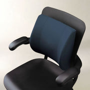 A dark navy blue ergonomic office chair cushion mounted on a black office chair, shown against a plain light beige background.