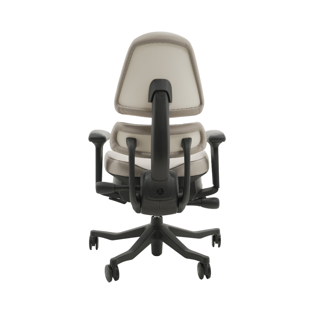 An ergonomic office chair with a high back, adjustable armrests, and a four-wheel base, shown from a rear angle on a white background.