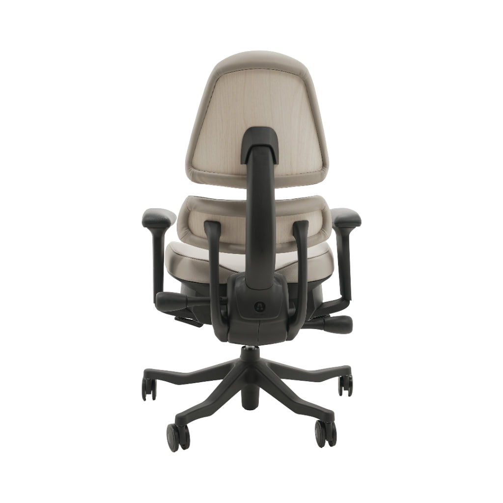 An ergonomic office chair with a high back, adjustable armrests, and a four-wheel base, shown from a rear angle on a white background.