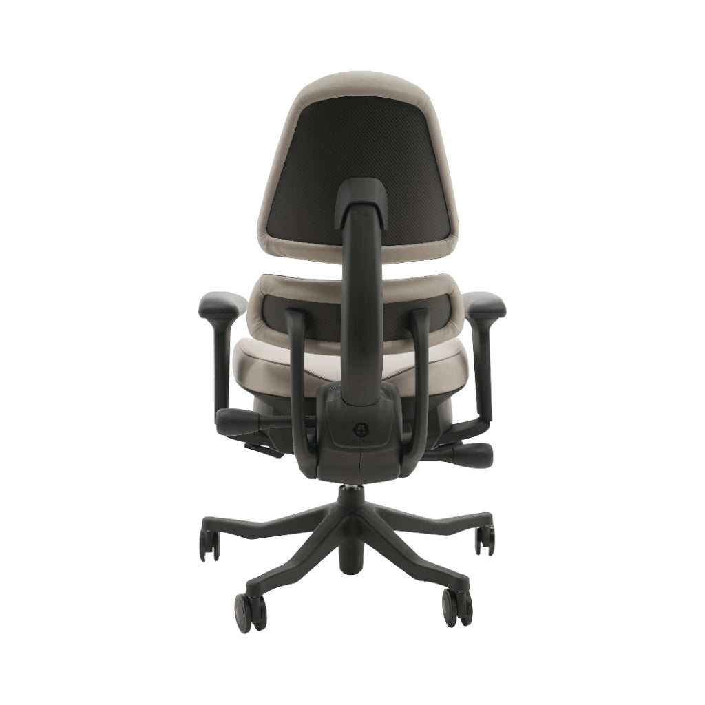 An ergonomic office chair with a high back, adjustable armrests, and a four-wheel base, shown from a rear angle on a white background.