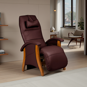 Merlot toned leather recliner chair in a room with a window and shelves.