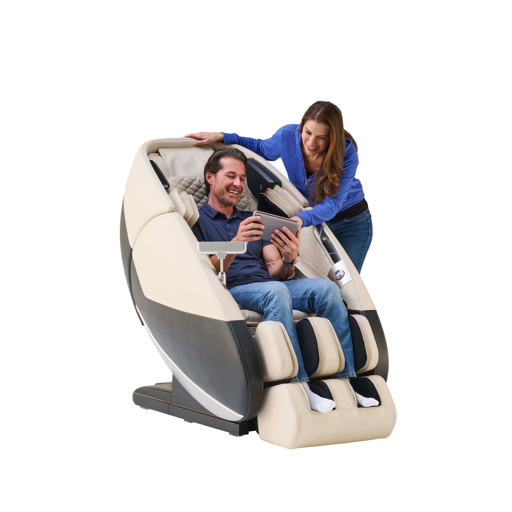 Mature couple using a massage chair with a tablet on a white background