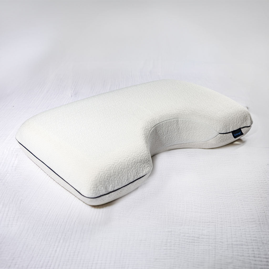 White U-shaped pillow on a white background