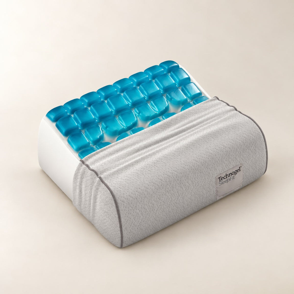 A Technogel memory foam cervical pillow with a gray fabric cover and a bright blue gel top, shown on a light beige background.