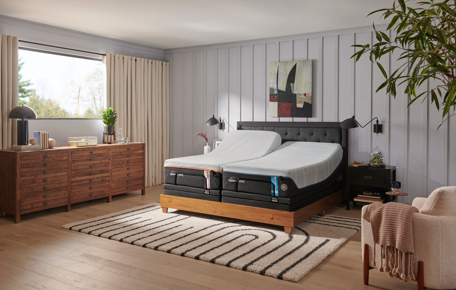 A Tempur-Pedic adjustable base and mattress in a bed room. 
