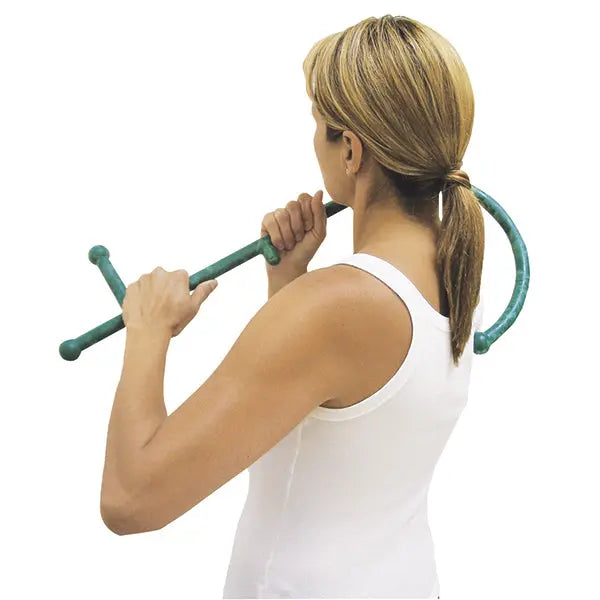 A woman using the Theracane massager on her shoulder against a white background.