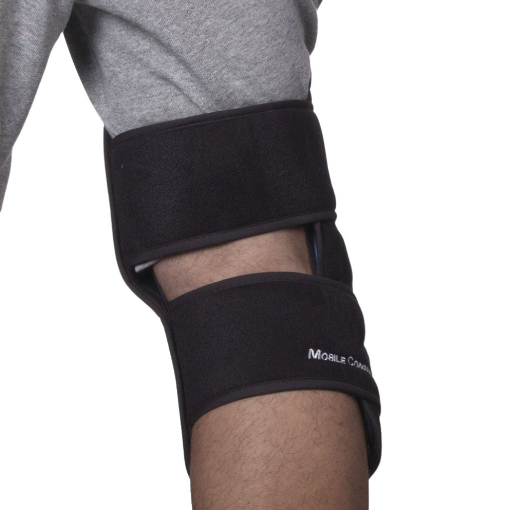 A close-up of a person's knee and lower leg wearing a black knee brace with adjustable straps. The brand name 'MOBILE KNEE' is printed in white on the lower strap.