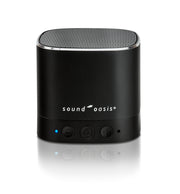 A black Sound Oasis portable Bluetooth speaker, white logo text, and three control buttons on a reflective white surface.