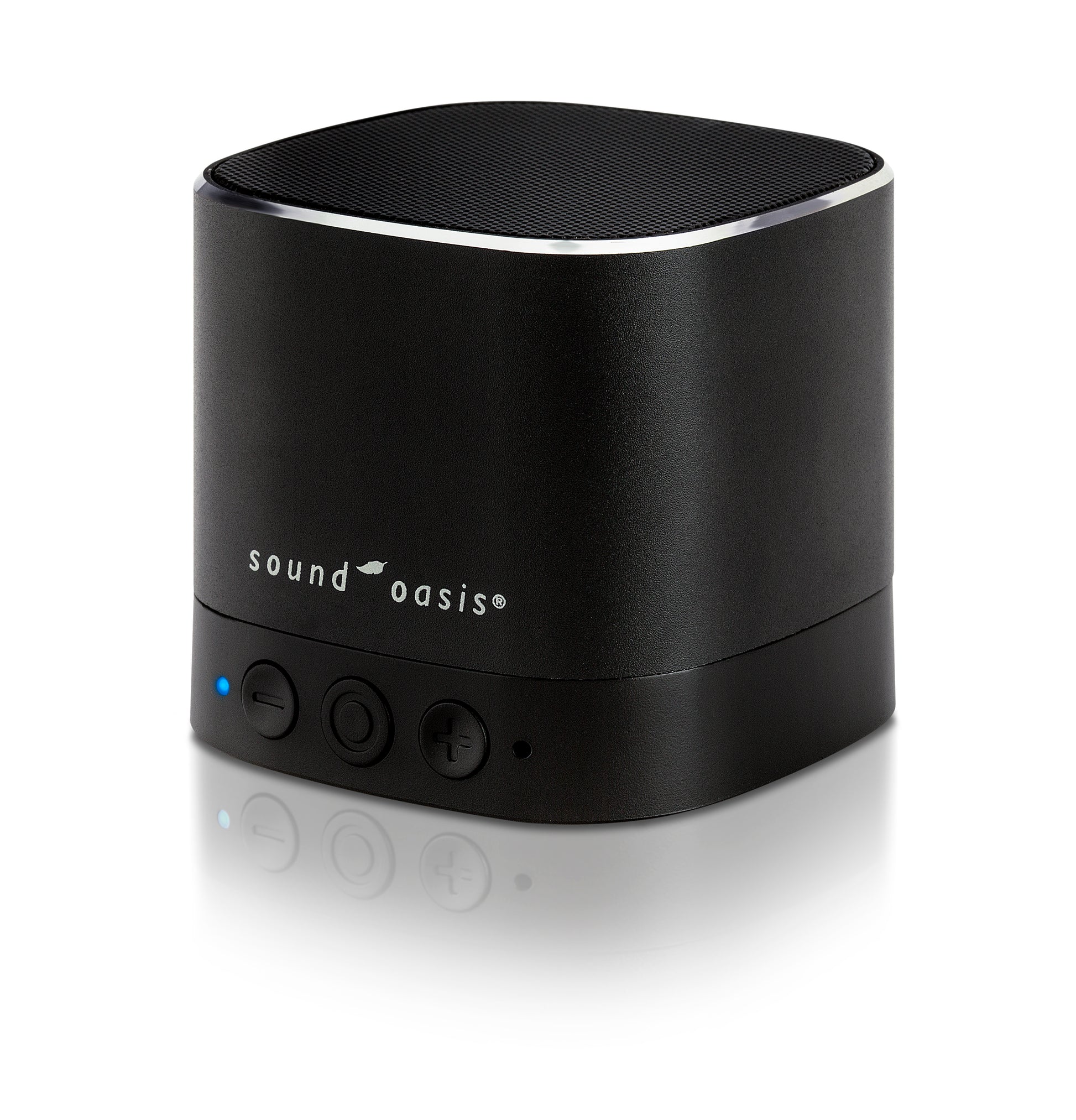 A black Sound Oasis portable Bluetooth speaker with a cylindrical design, featuring a textured top grille, a silver accent ring, and three control buttons on the front, set against a clean white background with a soft reflection.