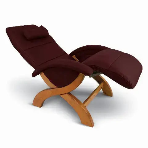 Andrew LeBlanc X-Chair 3.0 Recliner in Standard Wine Leather and a teak wood base in a white background