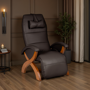 Zero-Gravity Recliner in Espresso leather with Teak wood base, styled in a warm mocha living room with wood panel walls, brass wall sconce, and indoor tree plant.