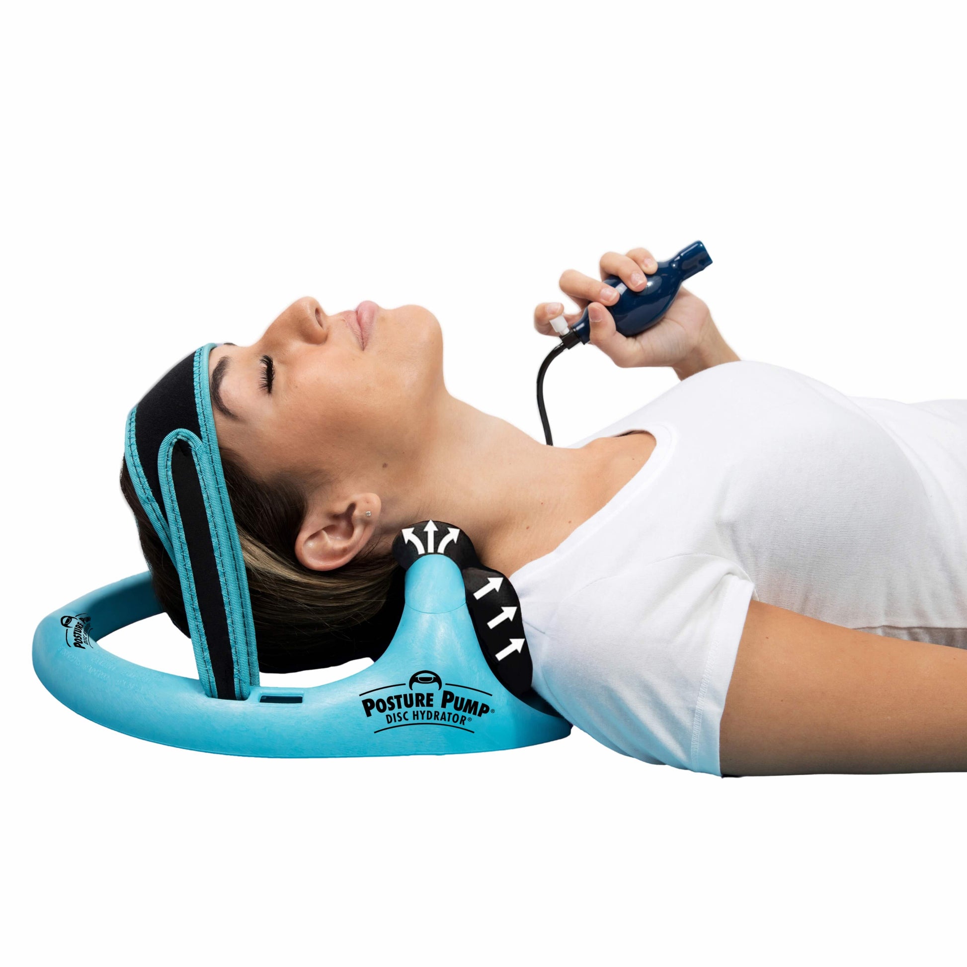 A woman lying down using the Posture Pump Hydration neck decompression device, which is light blue with black padding, while holding a blue control wand.