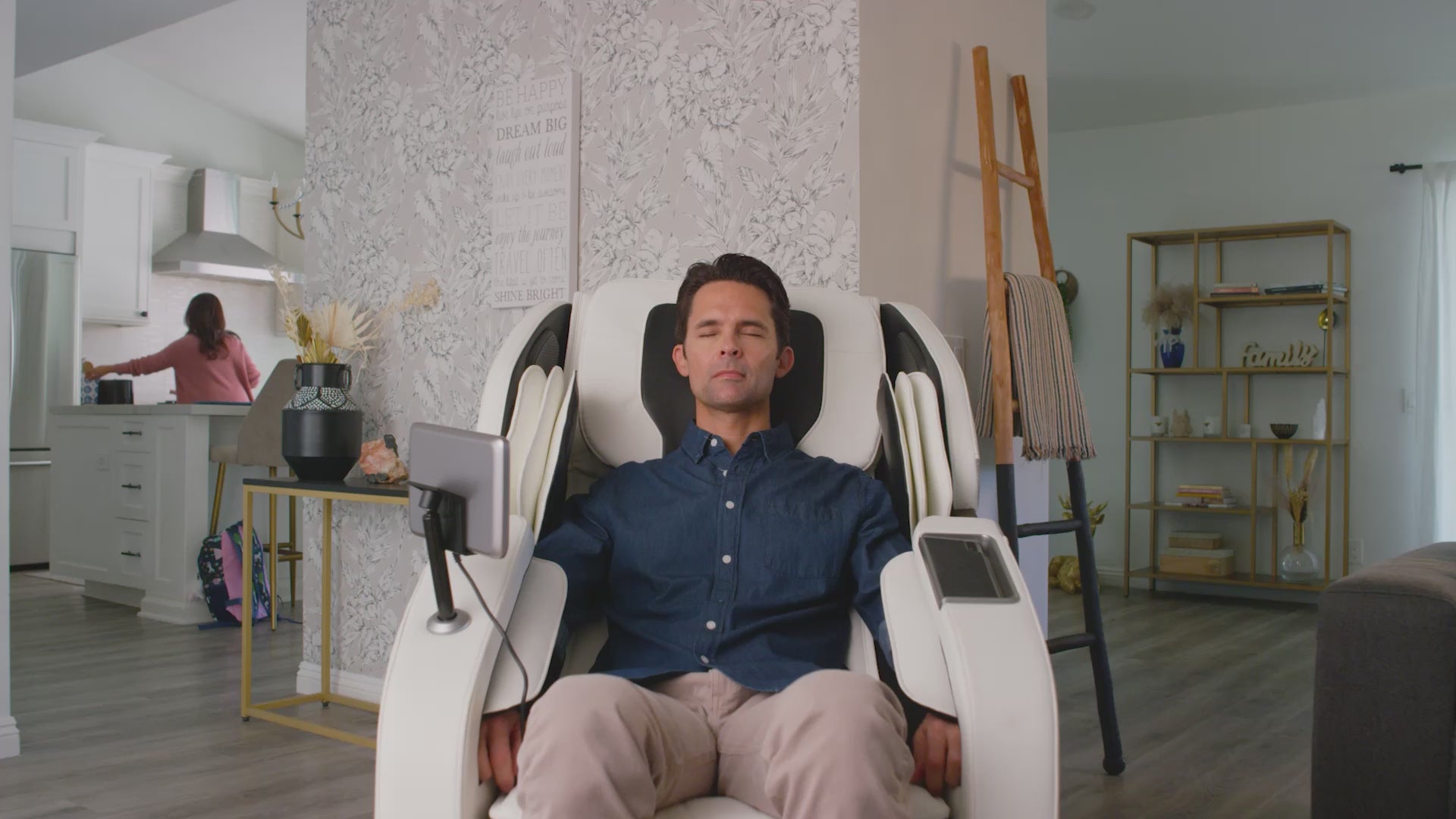 Load video: Video of a person relaxing in a Perfect Chair zero-gravity recliner in a living room, emphasizing ergonomic comfort and spinal alignment.