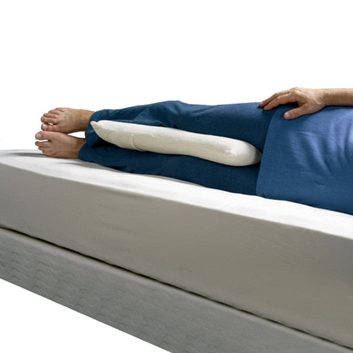 Lower half of a person using hte contour sleep posture cushion