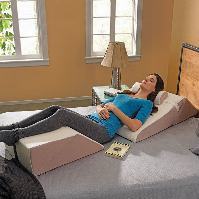 Women reading while supported by the ContourSleep Bed Wedge System
