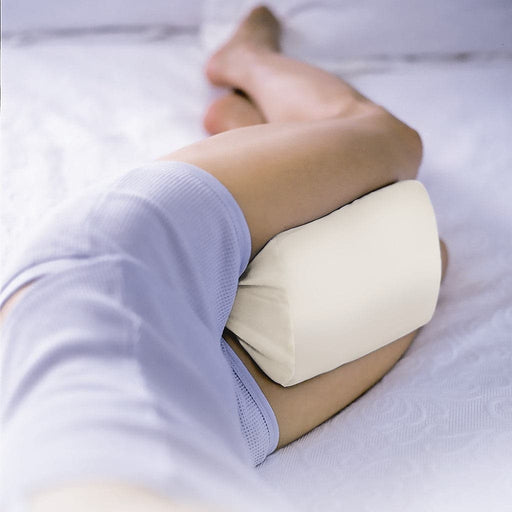 Bottom Half of female sleeping on side using the Contour Knee Spacer Pillow