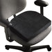 Side view product image of the ContourSit Wedge Cushion in a gray chair