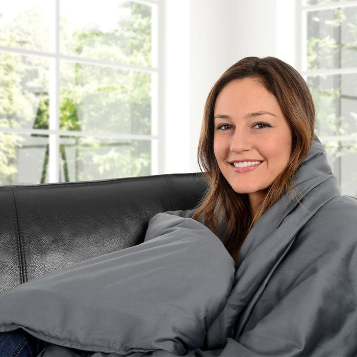 Delos weighted blanket woman sitting on couch