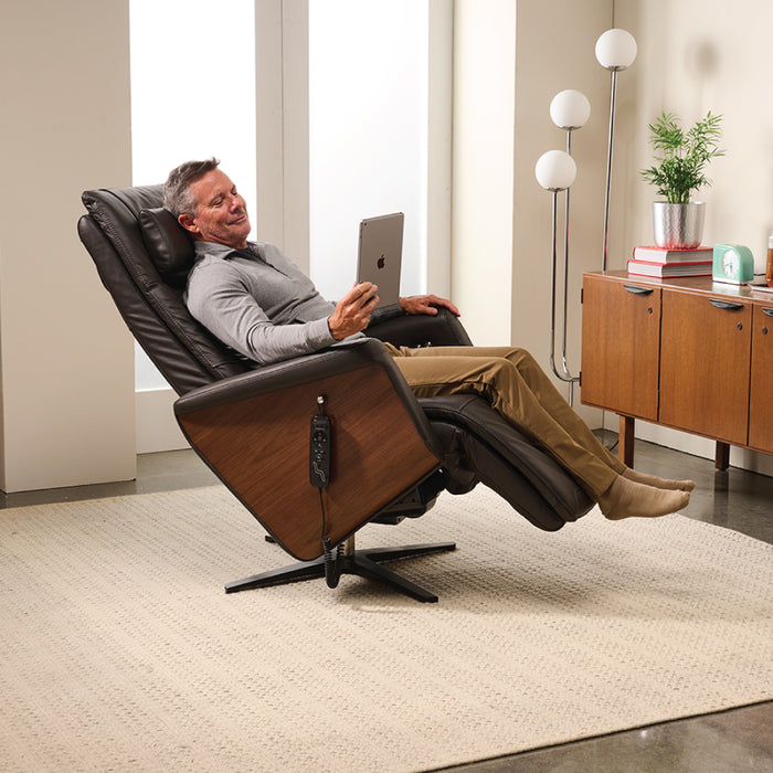 A man using the Circa Zero Gravity Swivel Chair by Human Touch in espresso | Relax The Back