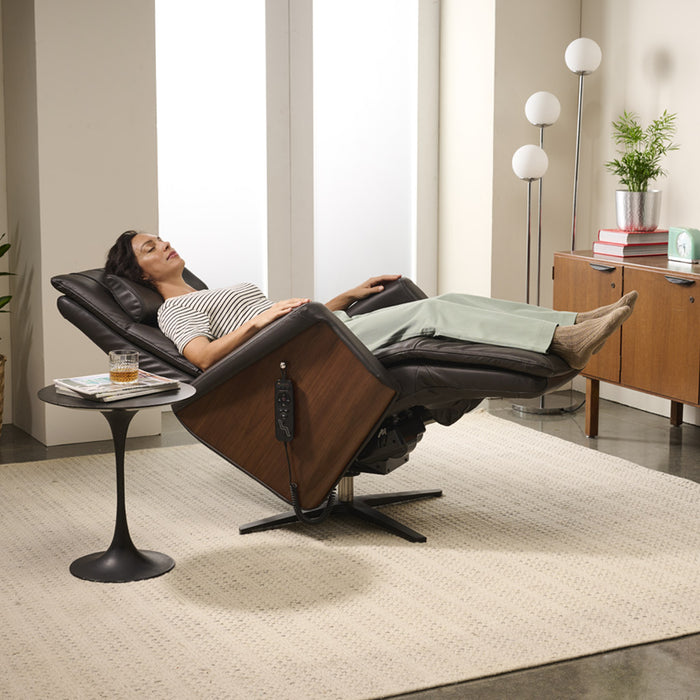 A woman using the Circa Zero Gravity Swivel Chair by Human Touch in espresso | Relax The Back