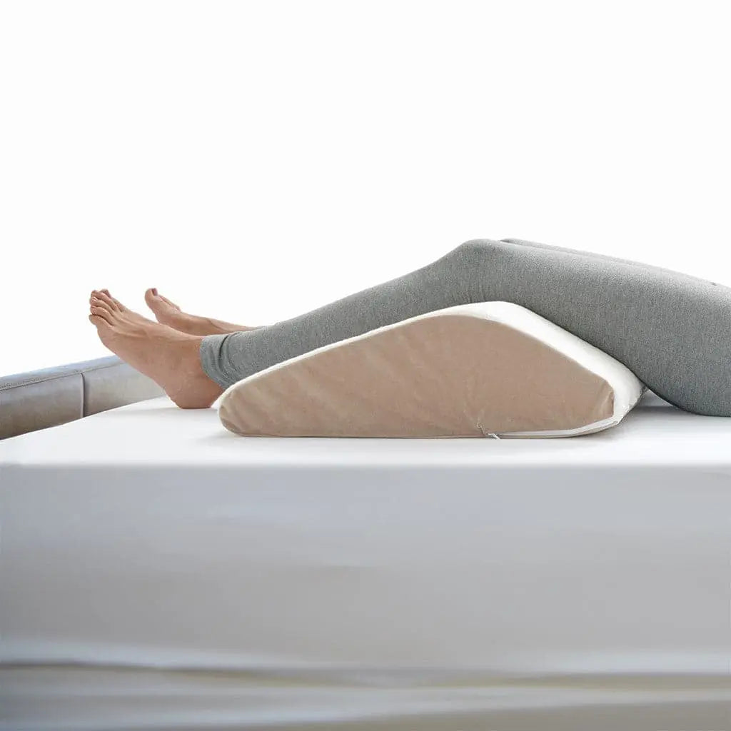 Sloped Knee Lift with someone's leg over it