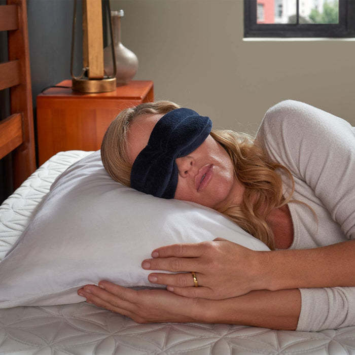 Woman sleeping and wearing the Tempur Pedic Sleep Mask