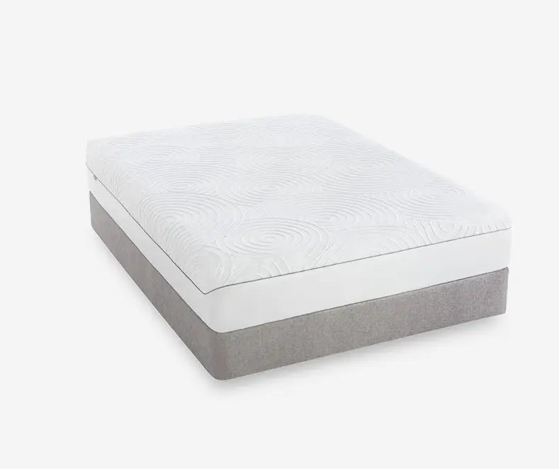 Bed with the TEMPUR-Protect Mattress Protector on a white background